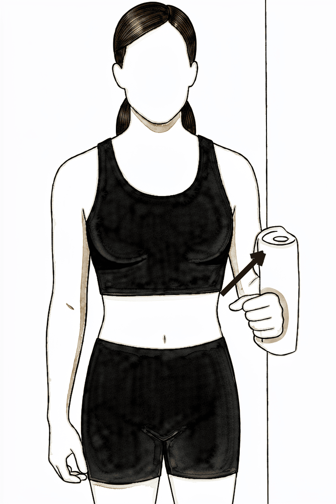 Standing with the elbow at the side, the outside of the arm presses gently outward against a wall without the arm moving.