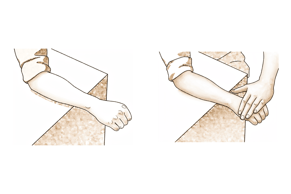Forearm resting on a table, palm up, the other hand pressing down against the hand while the wrist holds still.