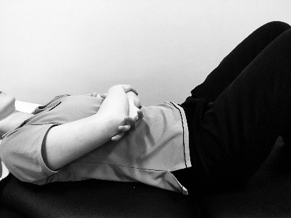 Lying down, lift the operated arm with the other hand under the elbow.
